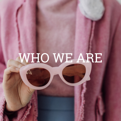 "Who We Are" with pink glasses and suit
